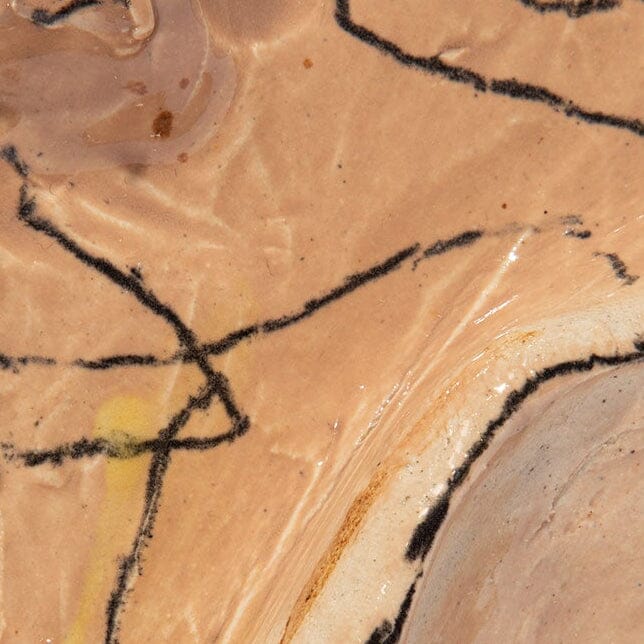 Crinkle glazed ceramic wall art detail, tan glaze with bold black outline marks