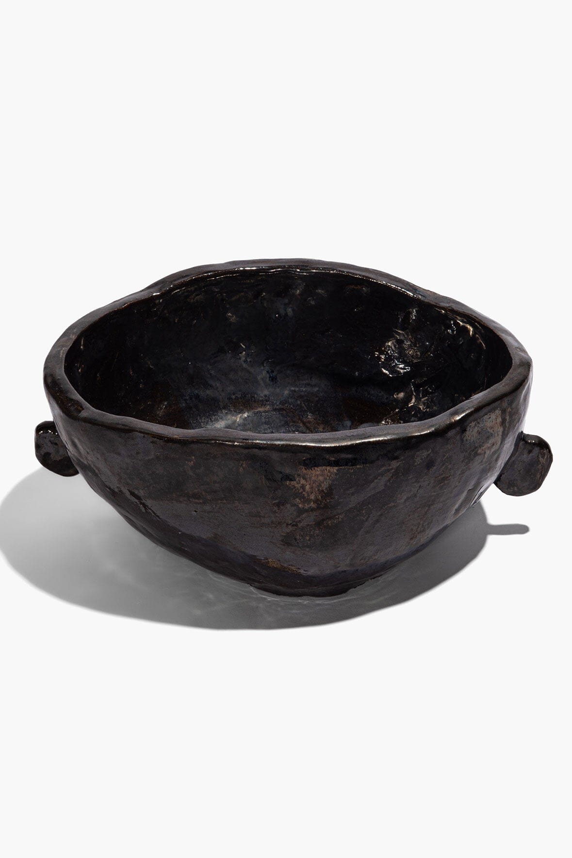 Large Henry bowl in dark glaze with sculpted rim and two side knobs; round interior.