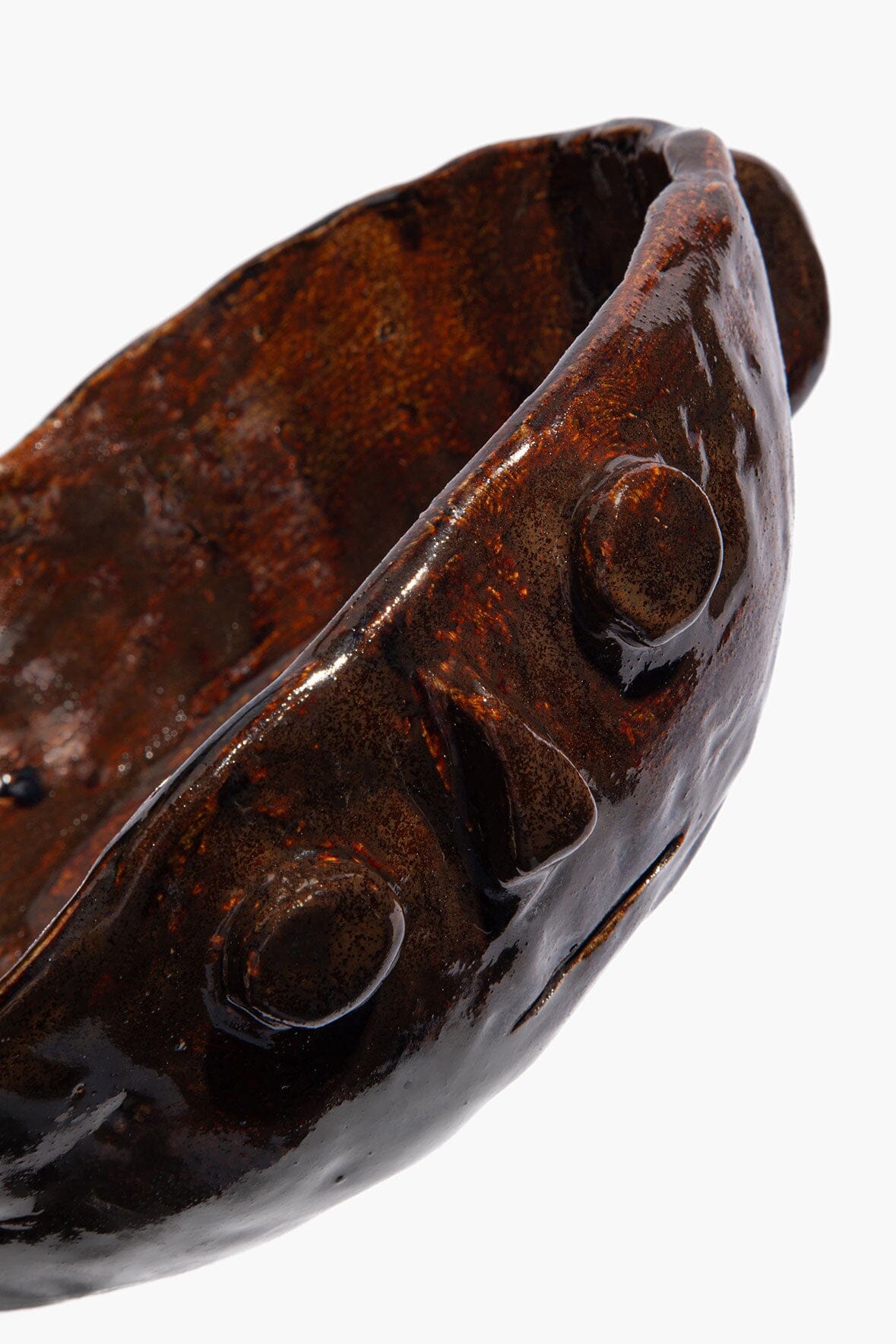 Medium Henry bowl detail, dark bronze glaze with molded accents and side handles.