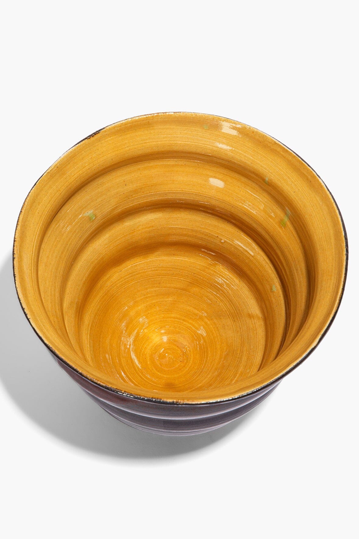 Stacked cone vase with mustard-yellow interior and dark burgundy exterior