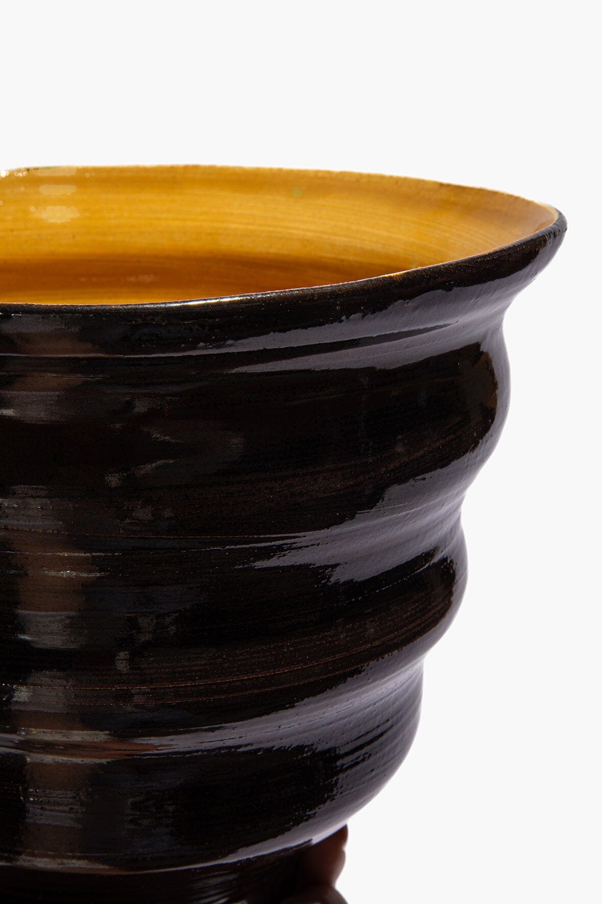 Stacked cone vase side detail with dark burgundy glaze and mustard rim