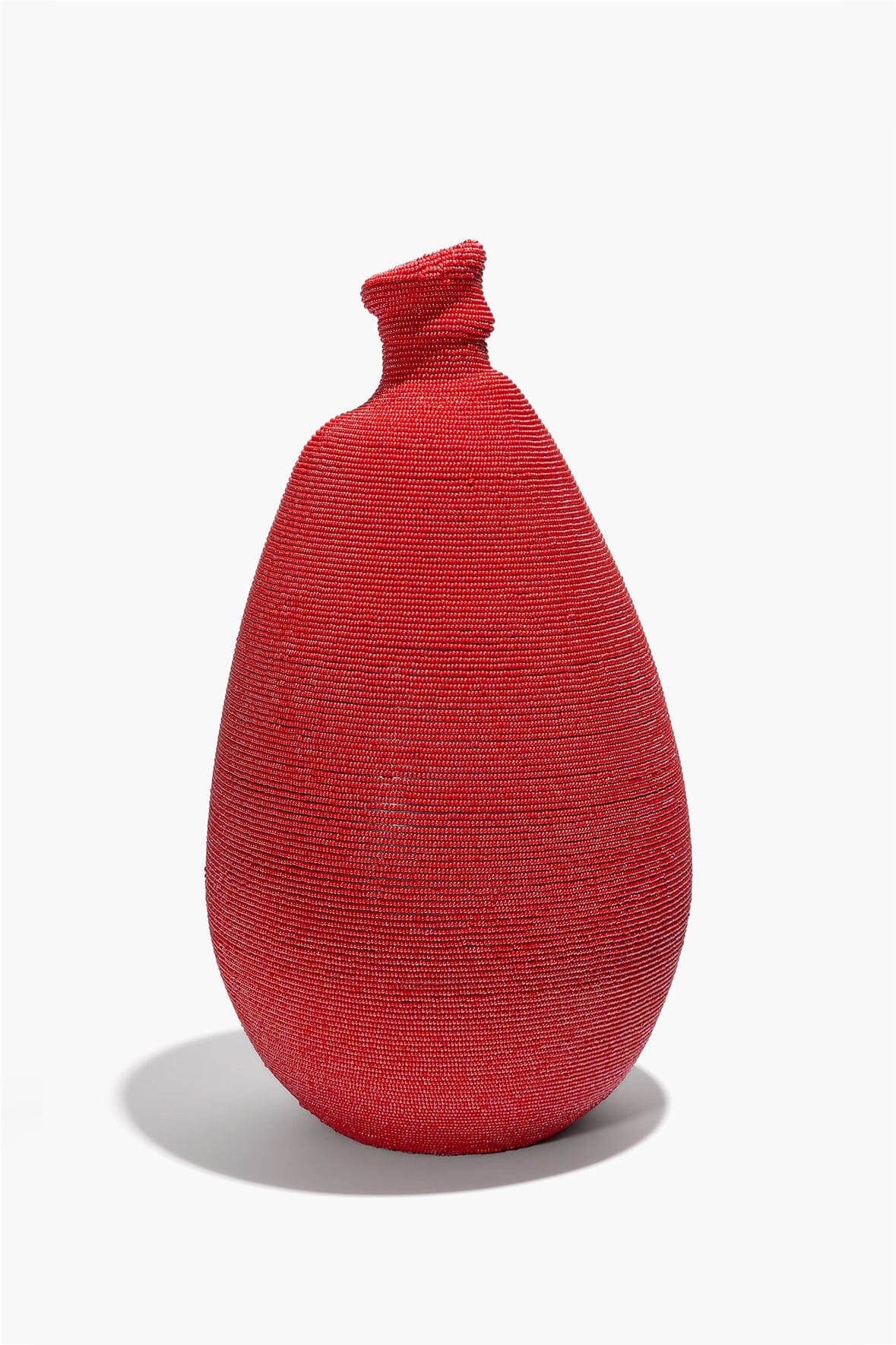 Red tall hand-beaded vase, full view with narrow neck and teardrop shape