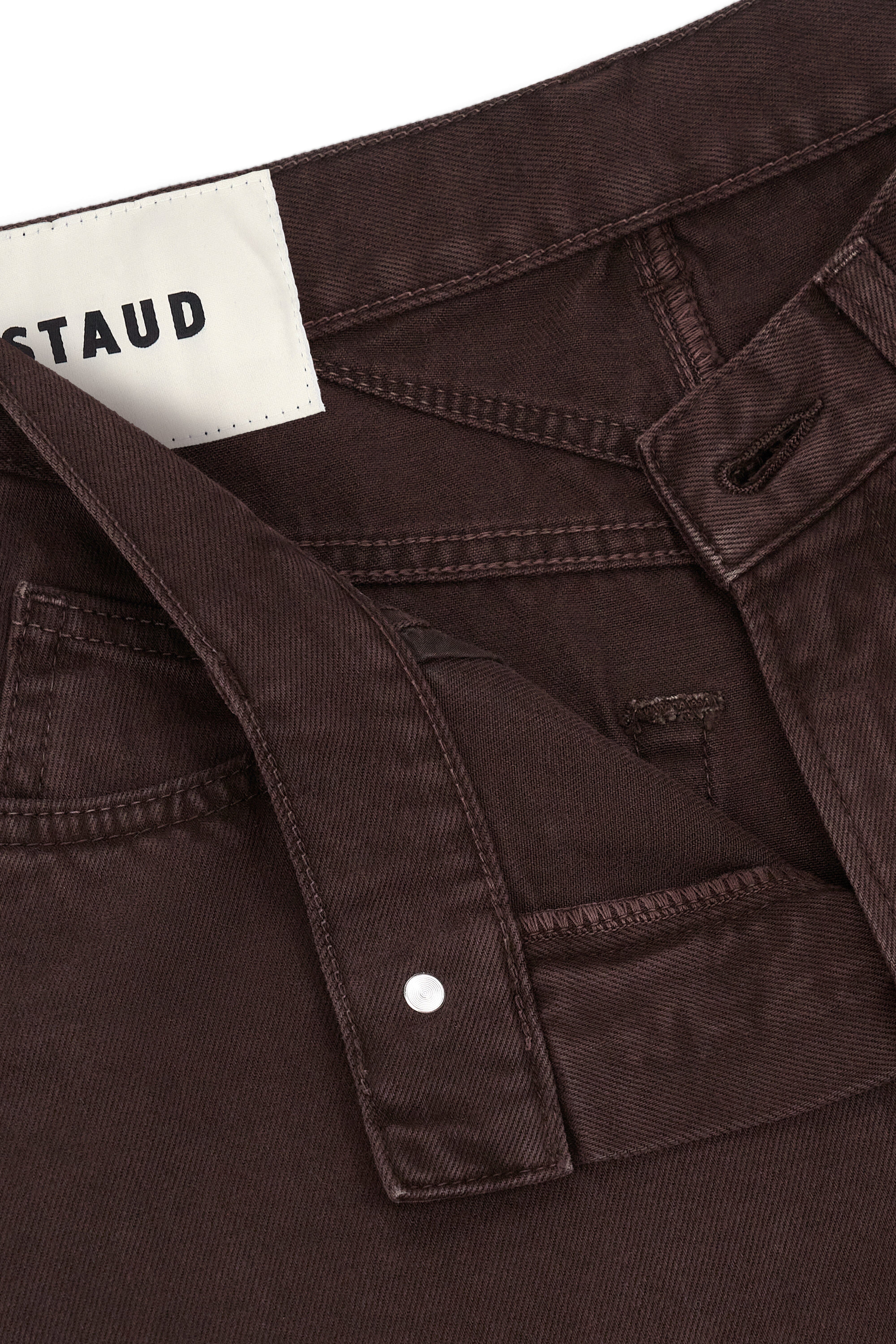 Brown barrel jeans inner label and front pocket with button closure
