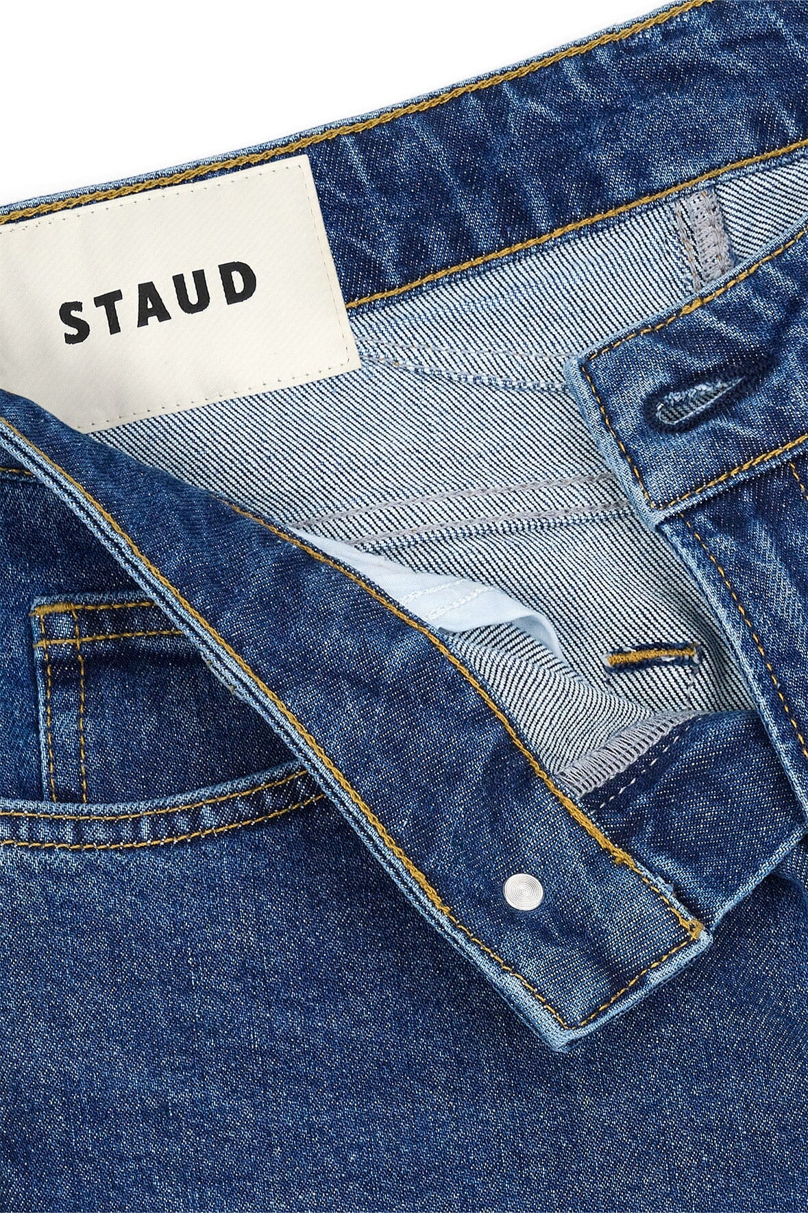 Stone blue stretch flare jeans waistband and front pocket with button fly
