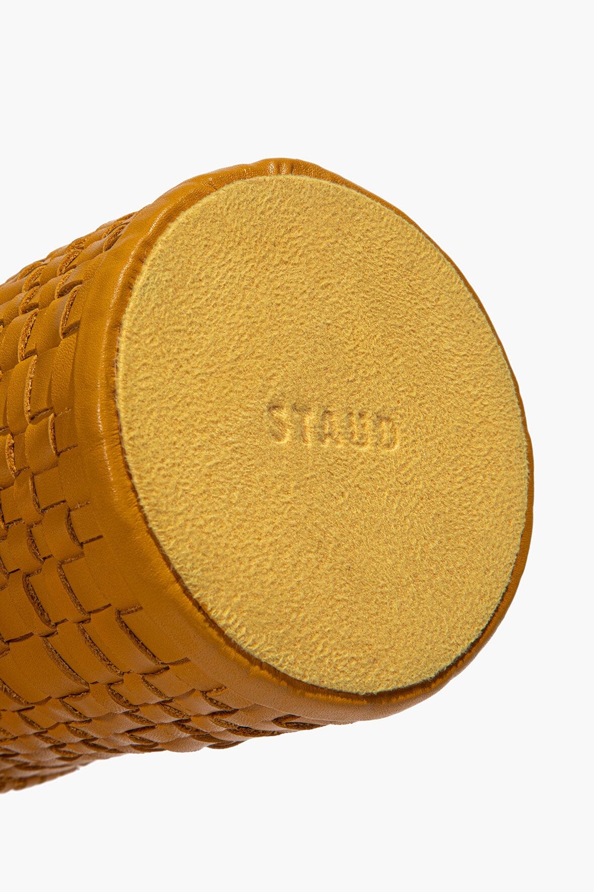 Woven goldenrod leather candle holder bottom with textured leather and stamped mark
