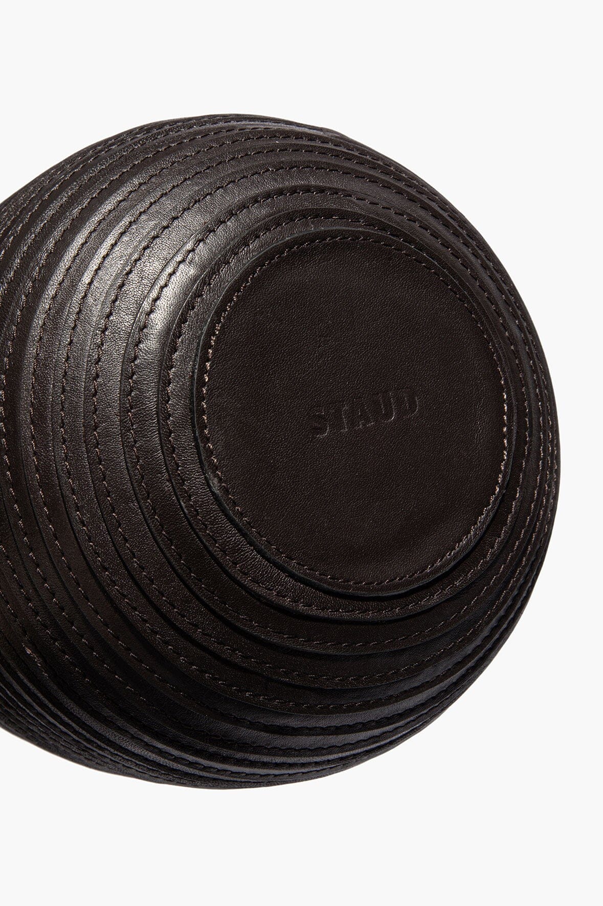 Wrapped vase bottom with stitched circular detailing and embossed logo patch