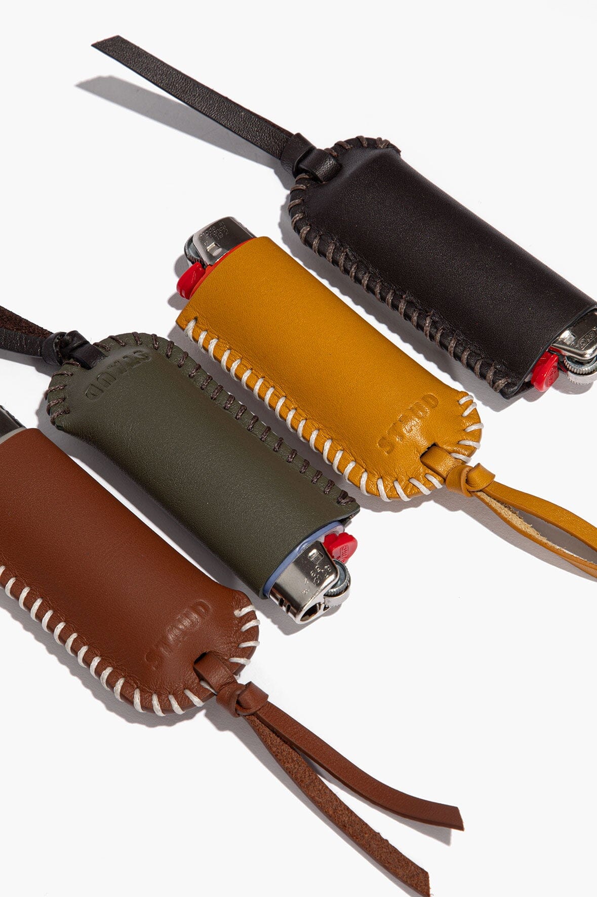 Moss leather lighter cover with metal snap, stitched trim, tie strap
