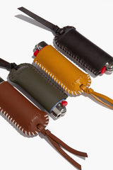 Moss leather lighter cover with metal snap, stitched trim, tie strap
