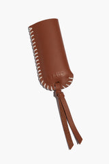 Brown leather lighter cover with white stitched edge and two hanging tie straps