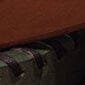 Close-up of leather edge seam with contrast stitched detail on dark tray