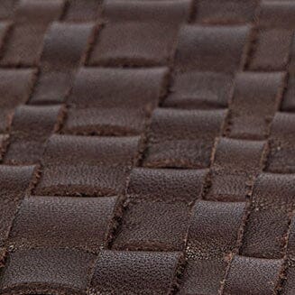 Close-up of espresso woven leather placemat texture with interlaced square pattern