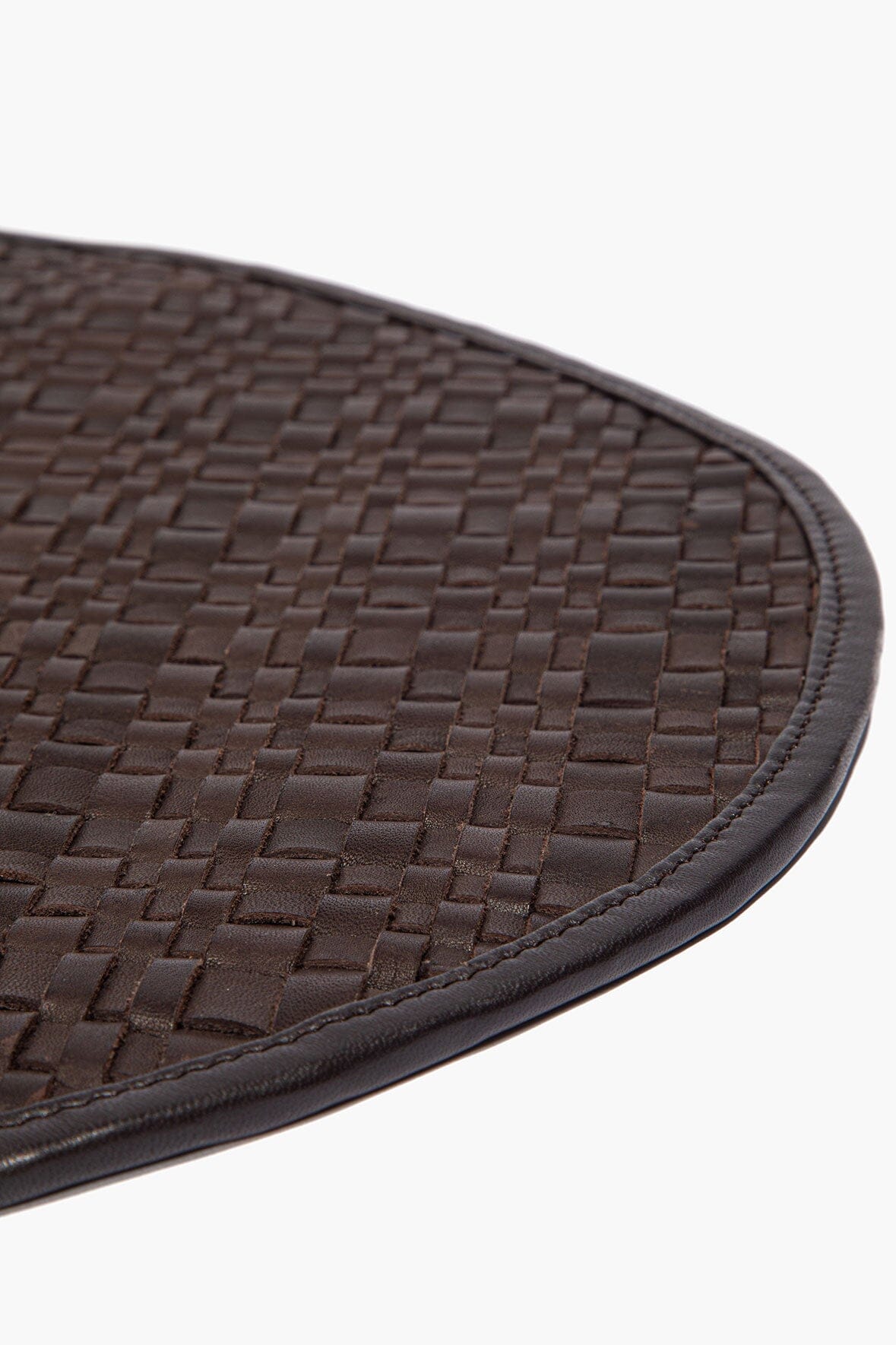 Espresso leather placemat edge with stitched border and woven basketweave texture
