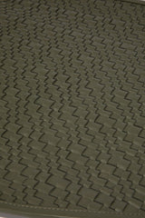 Moss green leather placemat with woven crosshatch texture, close-up