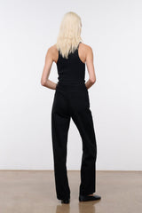 Black high-rise jeans back view with belt loops and center seam