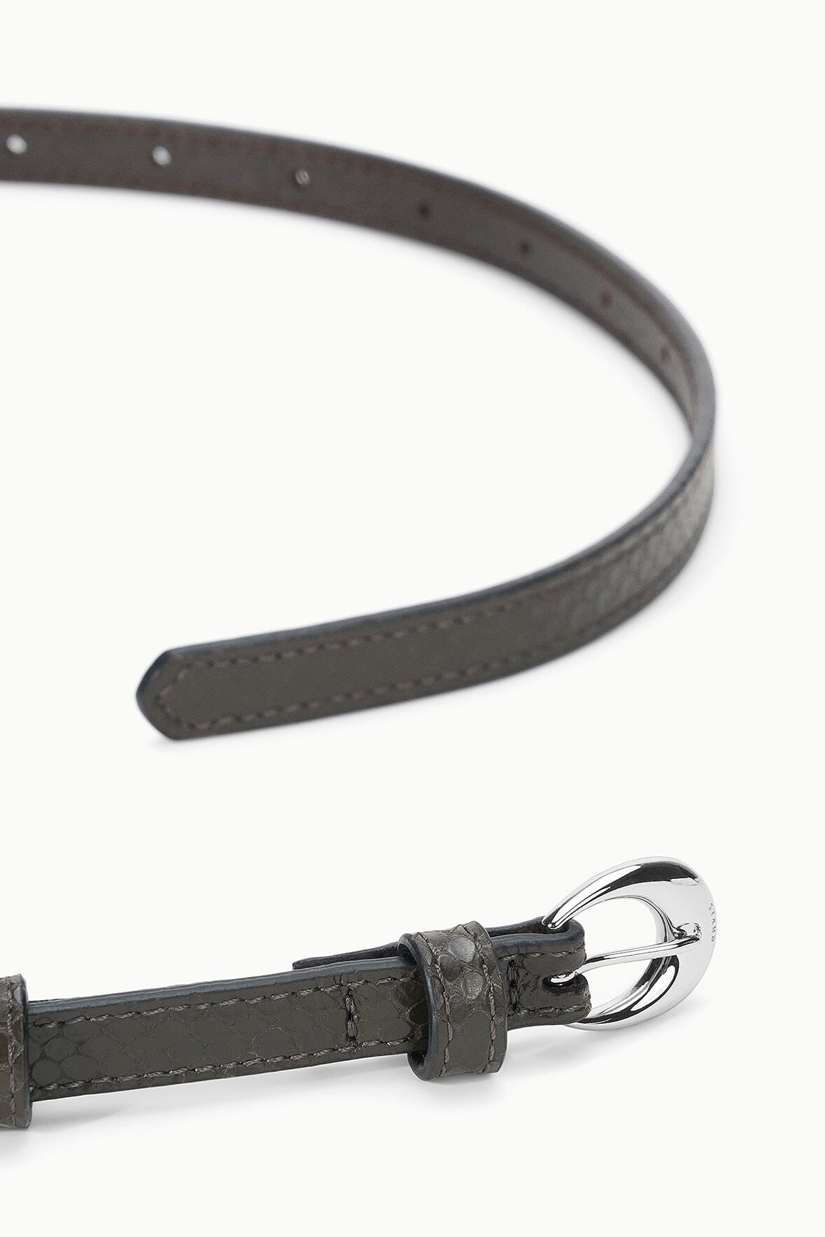 Dark brown snake-textured belt end with stitched tip and silver round buckle