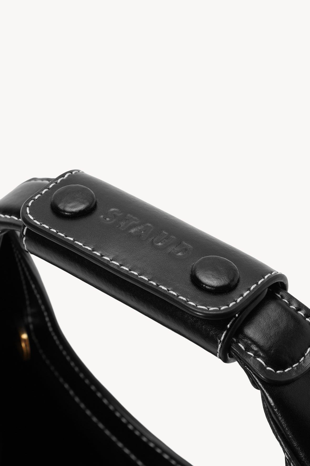 Black mini moon bag top strap with snap buttons and contrast stitching