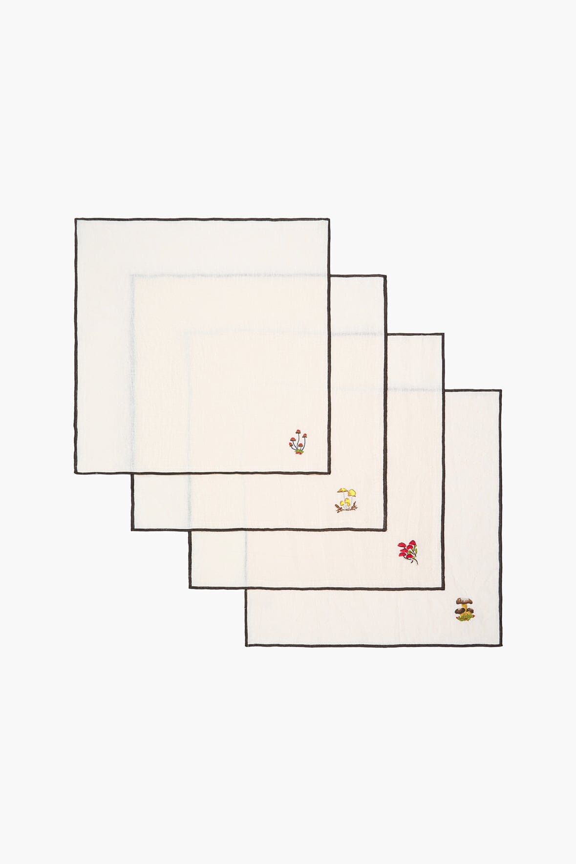 Natural embroidered napkins with colorful corner motifs, folded stack