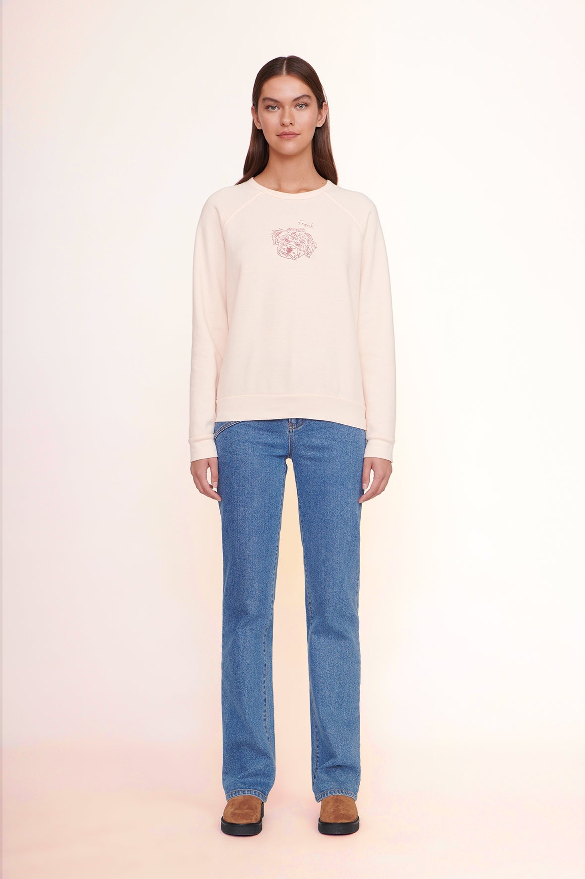 Light pink crewneck sweatshirt with chest graphic, ribbed cuffs and straight hem