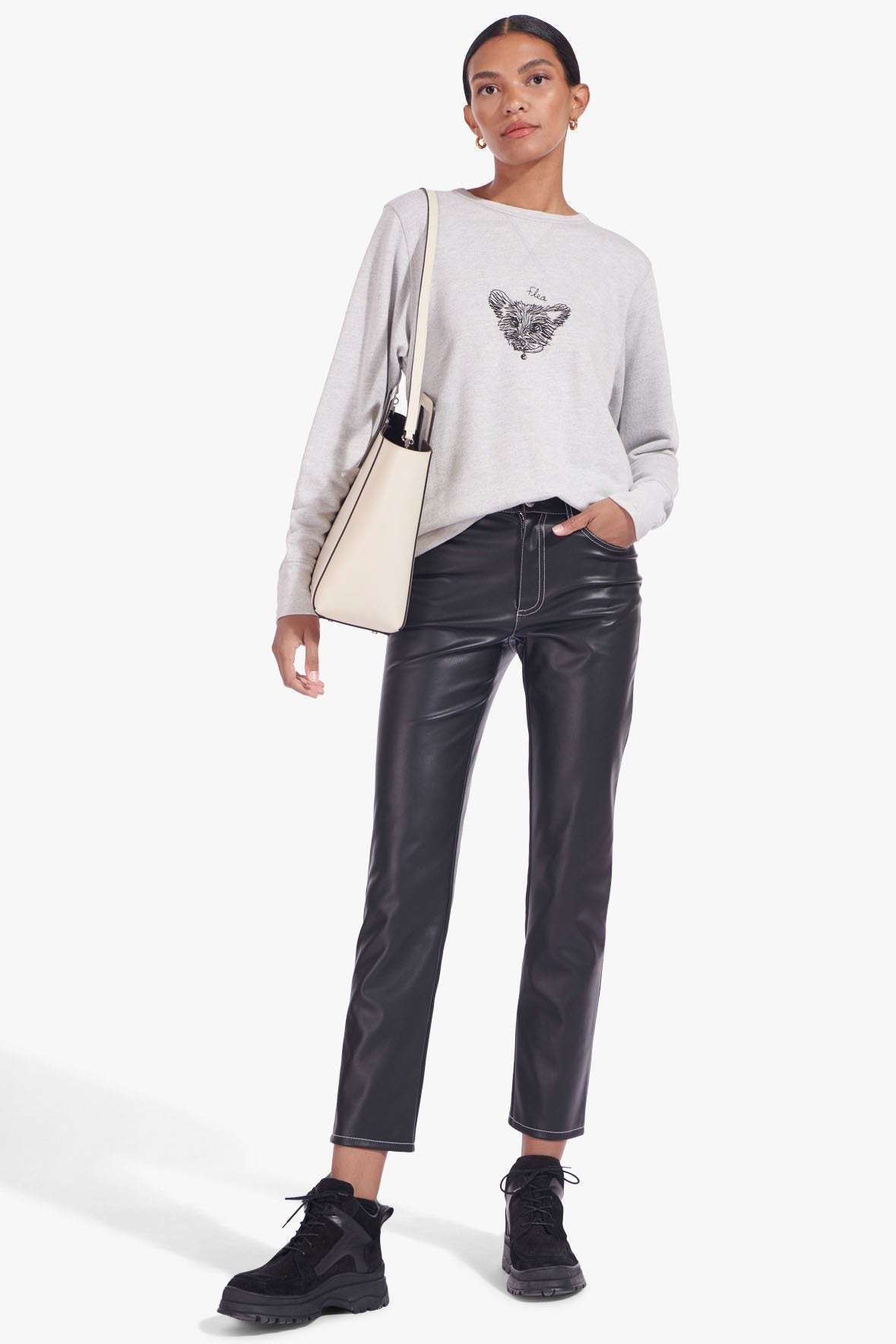 Cream leather shoulder tote with pet portrait front patch and gold-tone hardware.