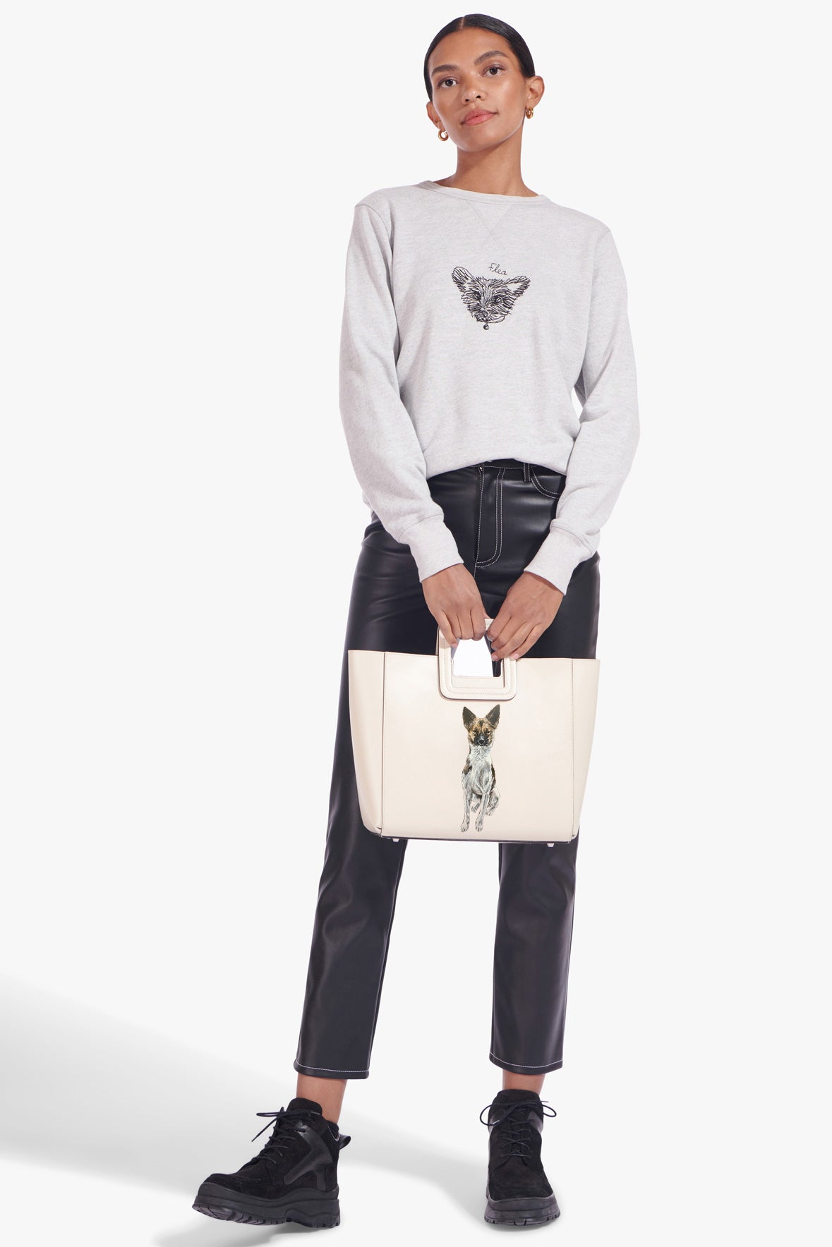 Cream leather tote bag with gold hardware and pet portrait front patch.