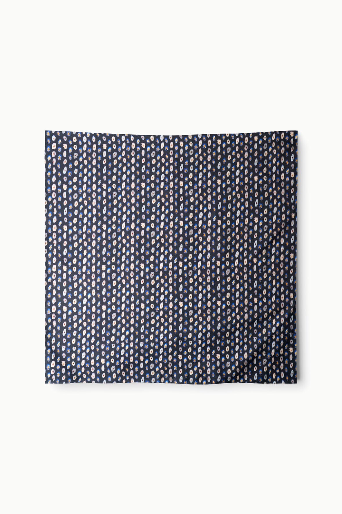 Cecile silk scarf with navy field and repeating small circular daisy pattern