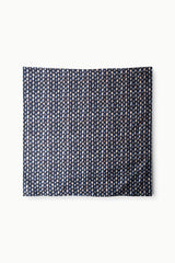 Cecile silk scarf with navy field and repeating small circular daisy pattern
