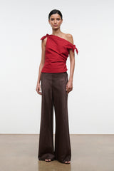 Red one-shoulder draped top with bow-tie shoulder detail and fitted ruched waist.