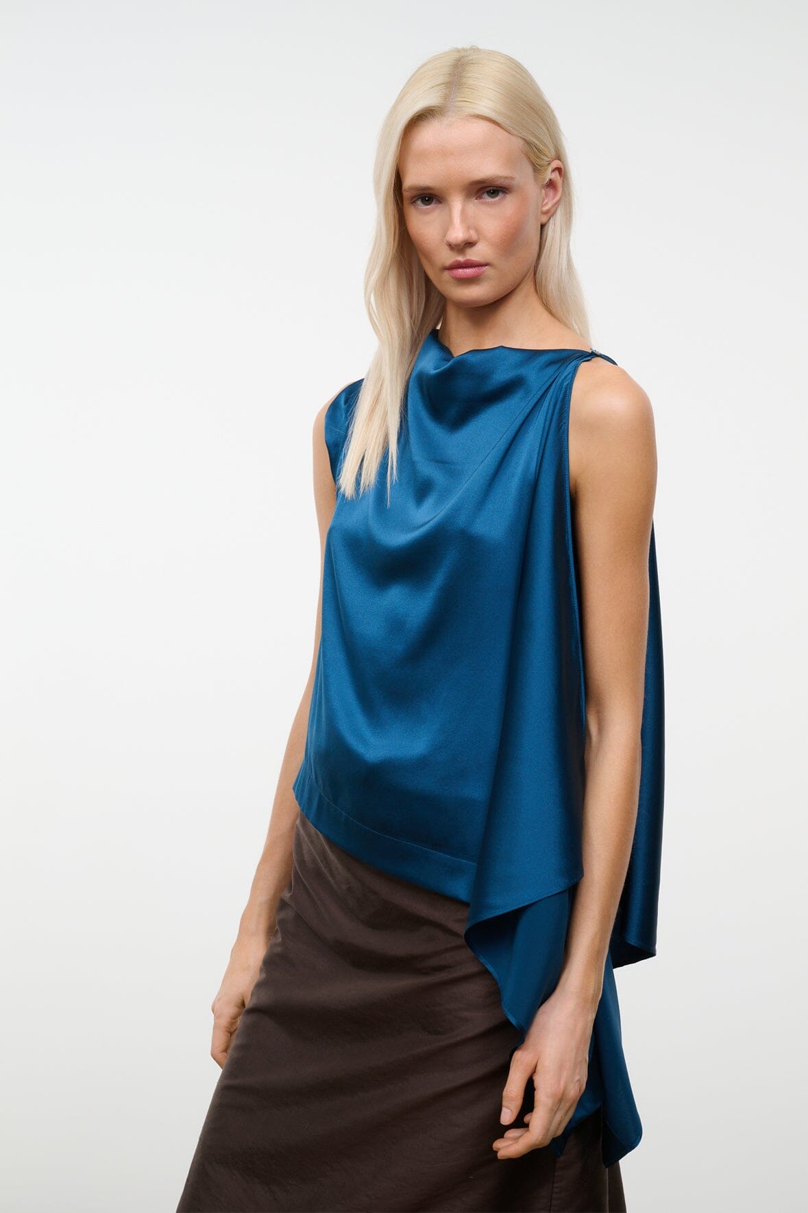 Blue draped silk top with cowl neck, sleeveless design and asymmetric hem