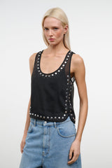 Black studded tank top with scoop neckline and silver studs, side-facing close-up