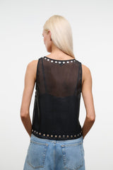 Black studded tank top with open back and silver studs along neckline and hem