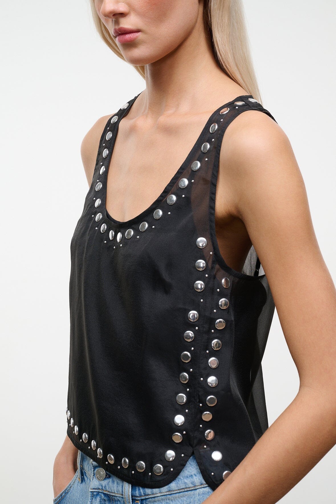 Black studded tank top with scoop neckline and vertical silver stud rows at center