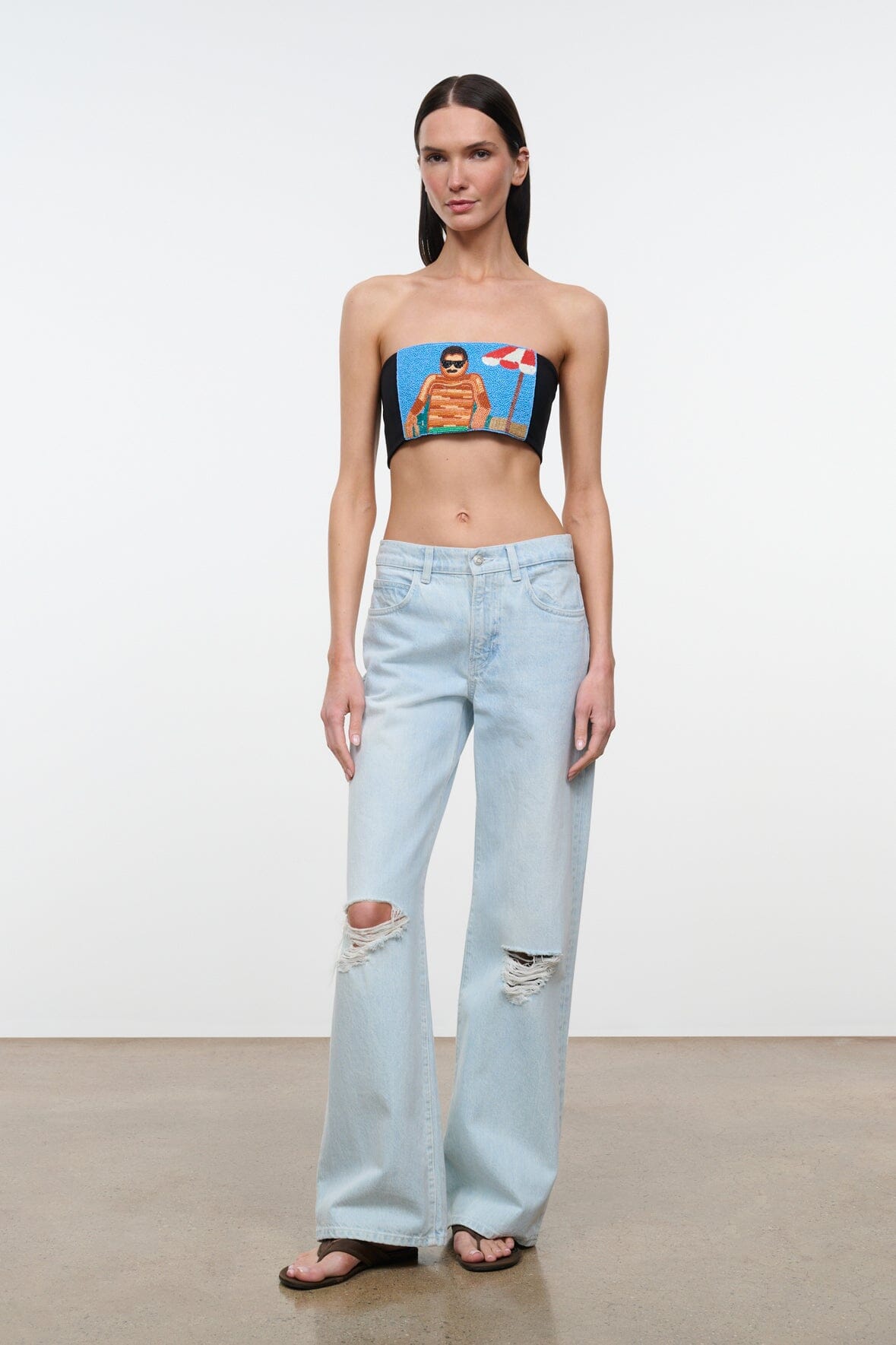 Black strapless tube top with colorful portrait graphic front
