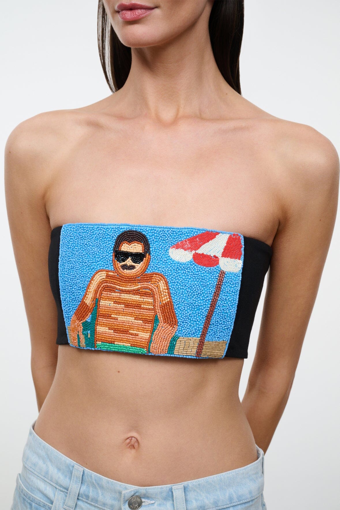 Black strapless tube top with multicolor artwork graphic and printed figures