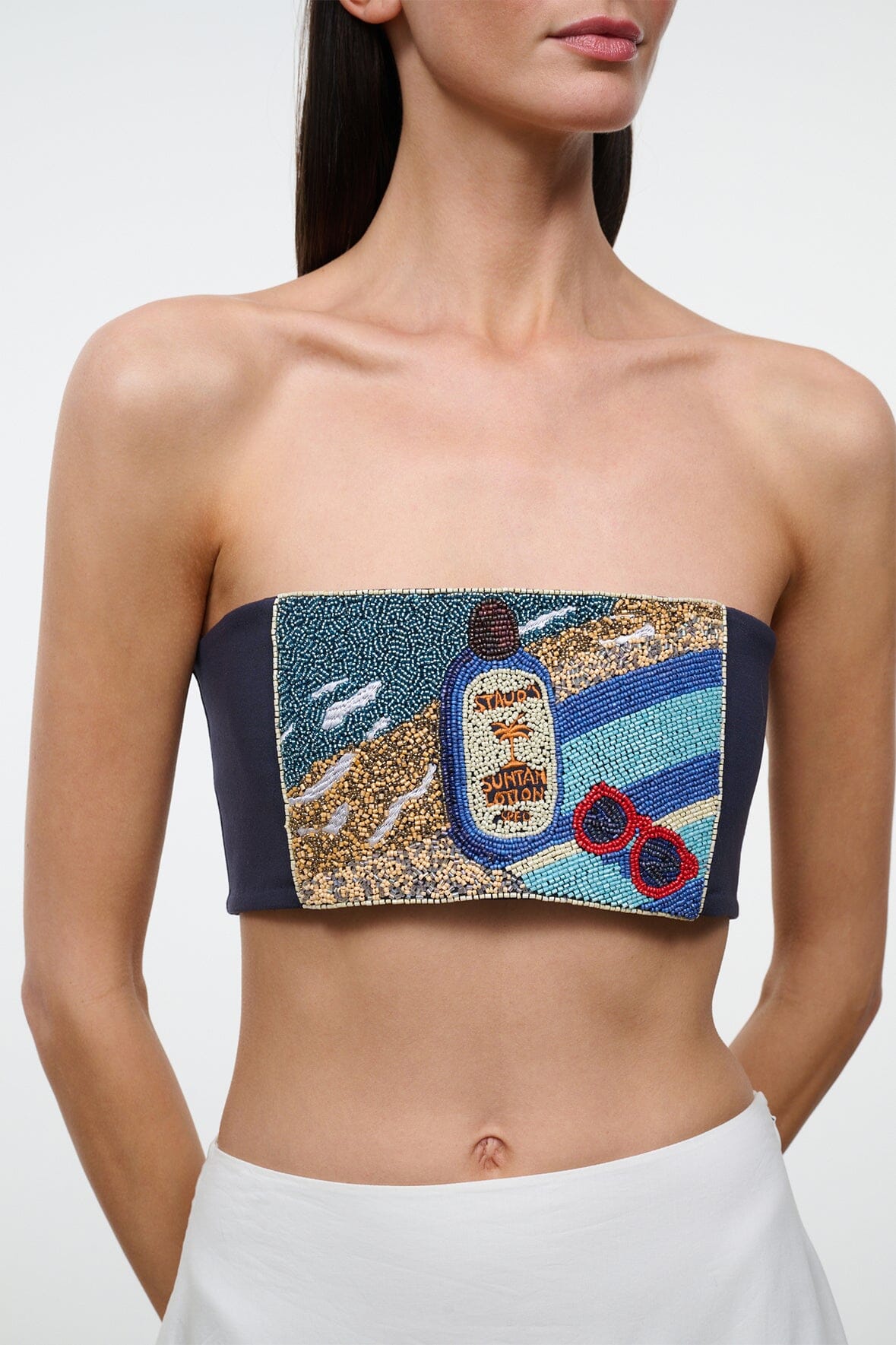 Strapless tube top with colorful graphic patch on navy band