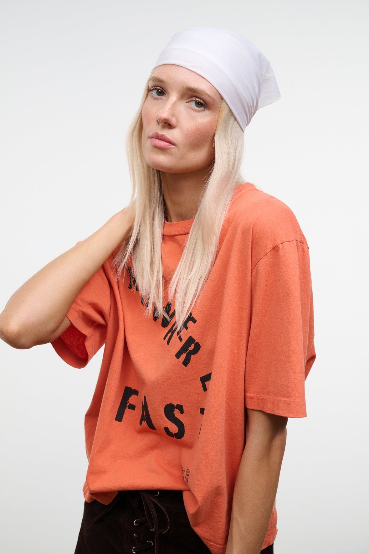 Ivory headscarf wrap cap with tucked edges, worn on the head