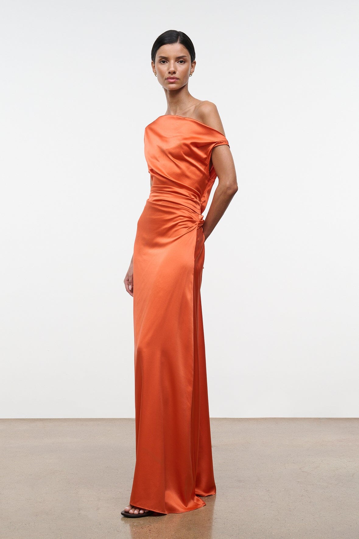 Orange silk maxi dress with draped neckline and fitted side seams