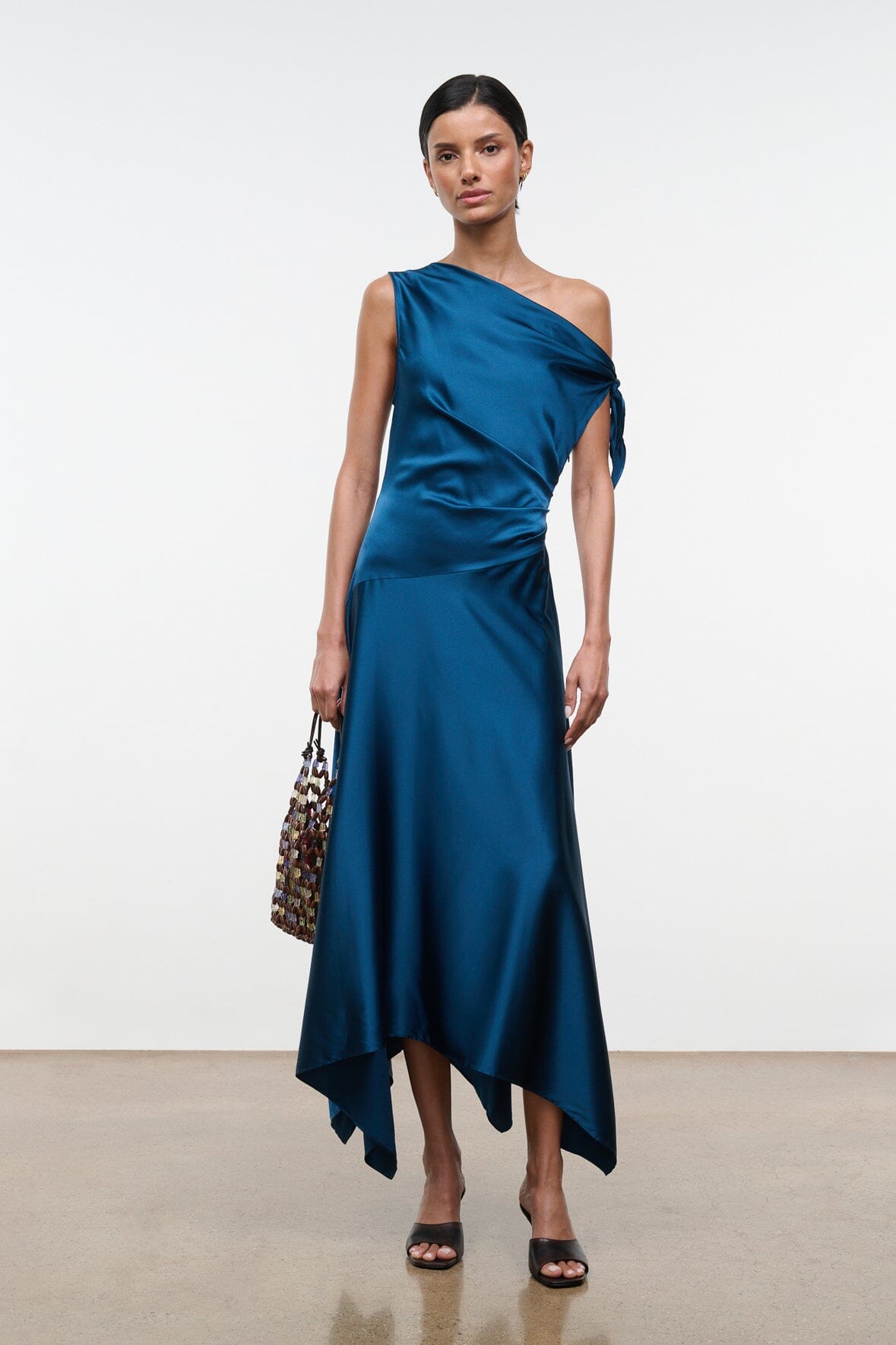 Teal-blue silk wrap one-shoulder midi dress with draped knot and asym hem