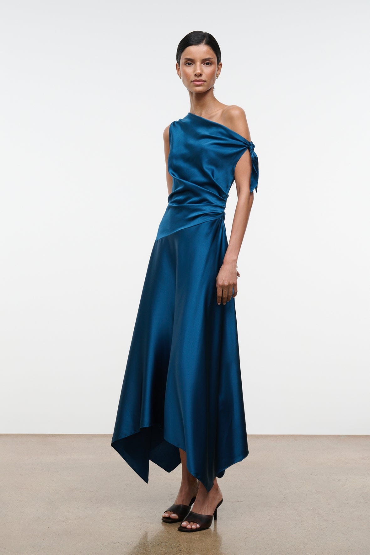 Teal-blue silk one-shoulder midi dress with side-tied drape and flared asym hem