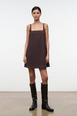 Dark brown sleeveless shift dress with square neckline and small stud embellishments along hem