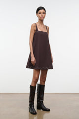 Dark brown sleeveless shift dress with studded square neckline and hem, shown at angle
