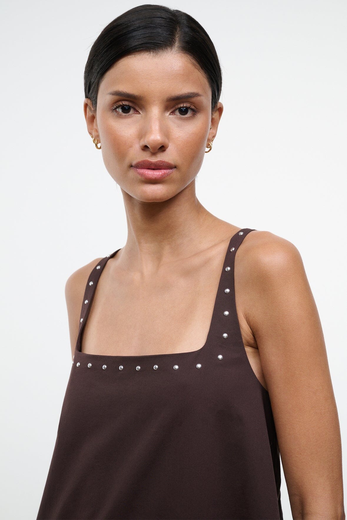 Dark brown sleeveless dress bodice with square neckline and silver stud embellishments