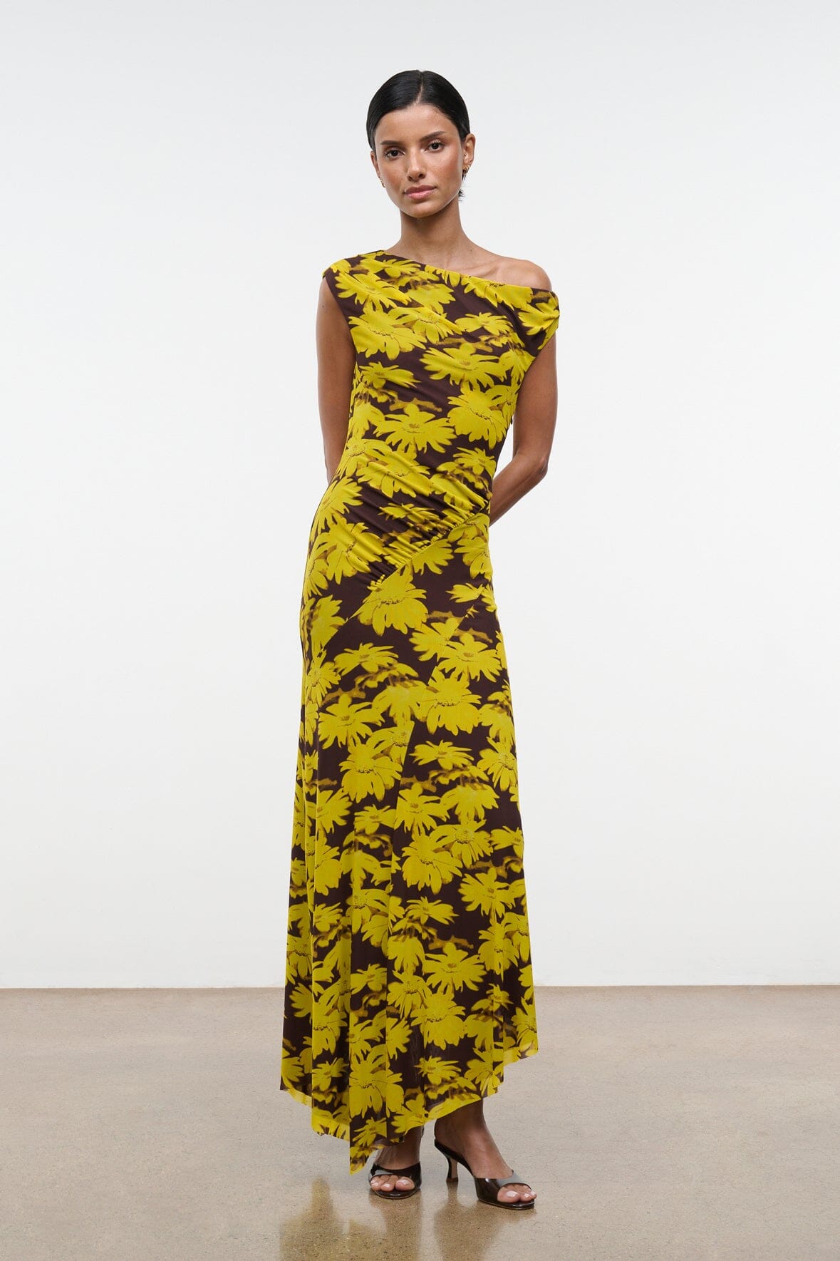 Sleeveless off-shoulder printed maxi dress, yellow daisy-like pattern on dark