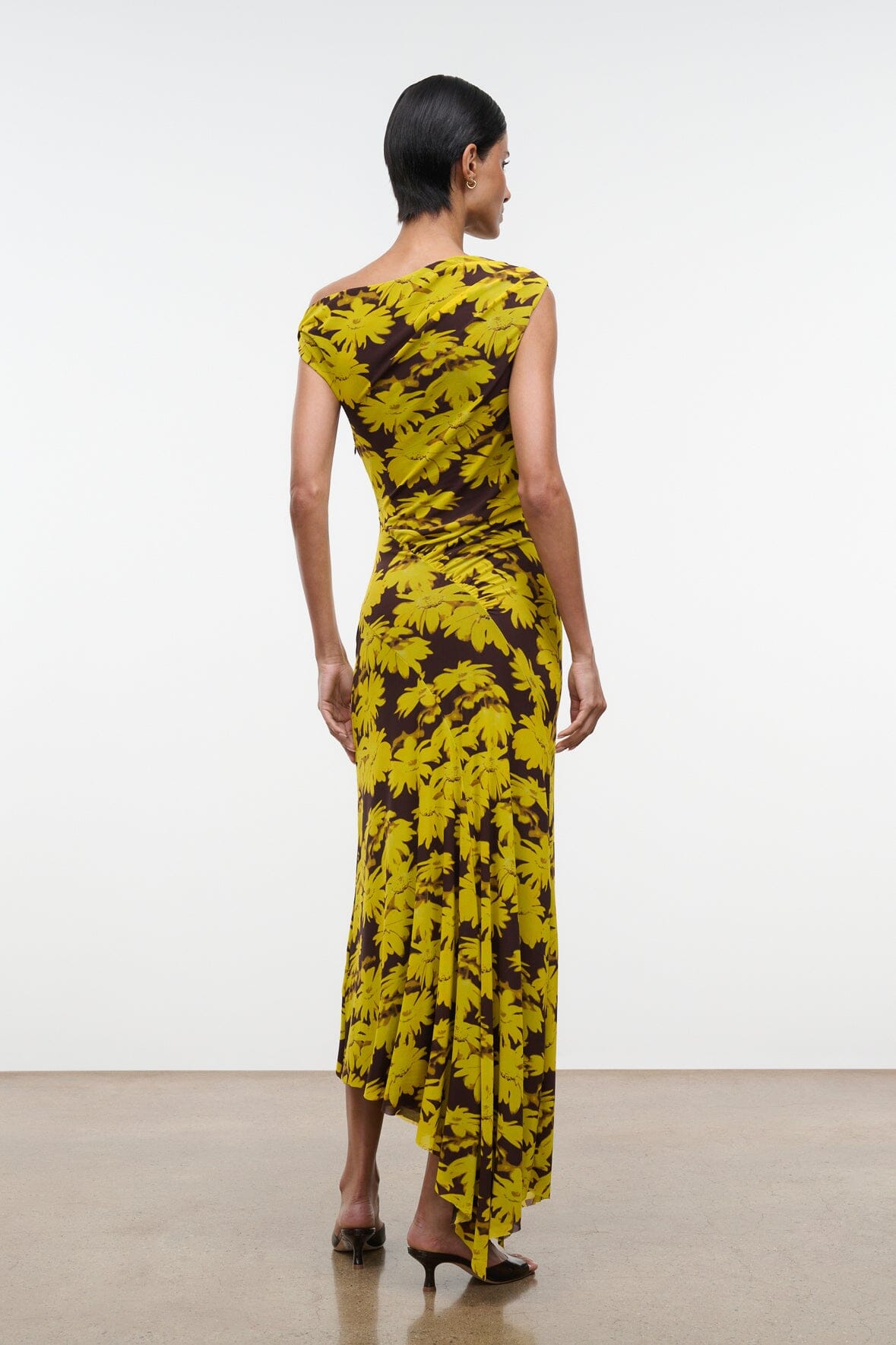 Back view off-shoulder printed maxi dress with yellow floral pattern on dark