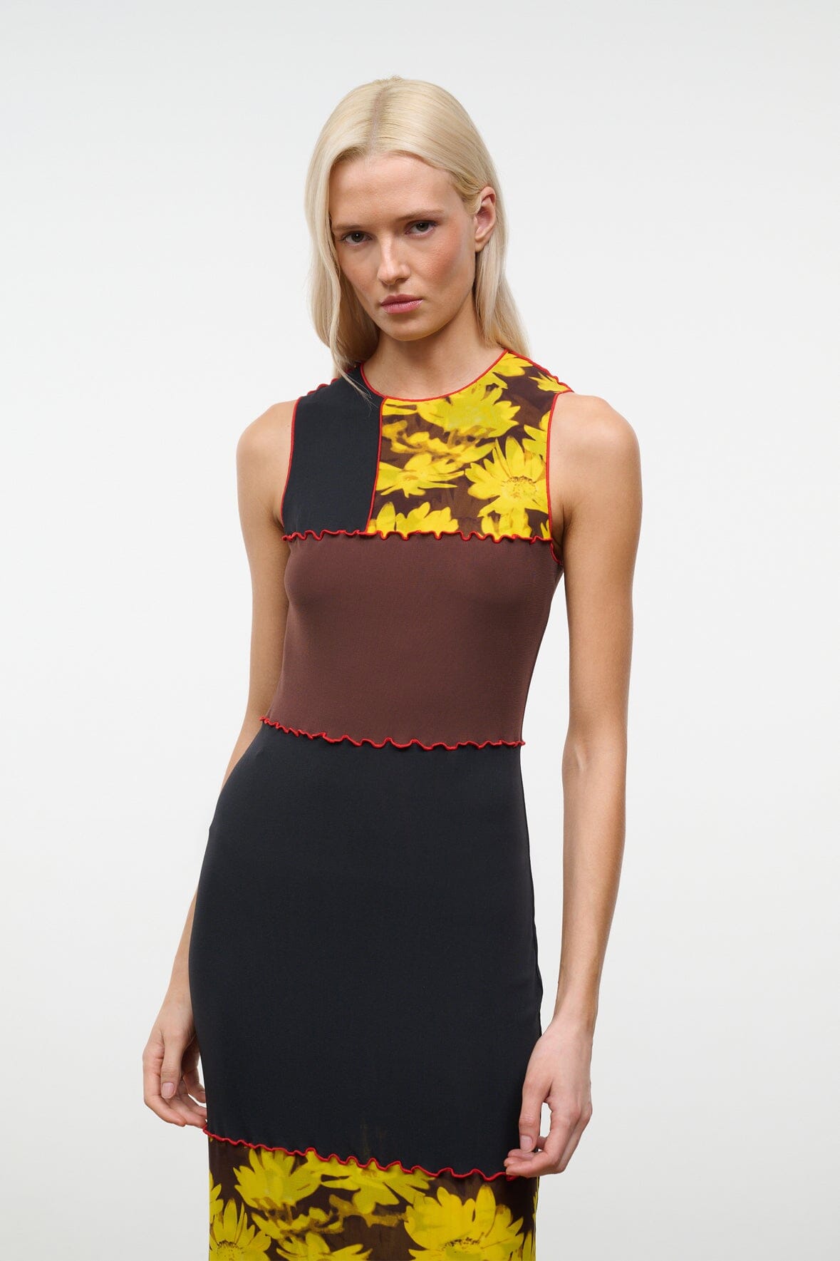 PRIMO sleeveless dress with round neckline, black bodice, brown panel, yellow daisy print