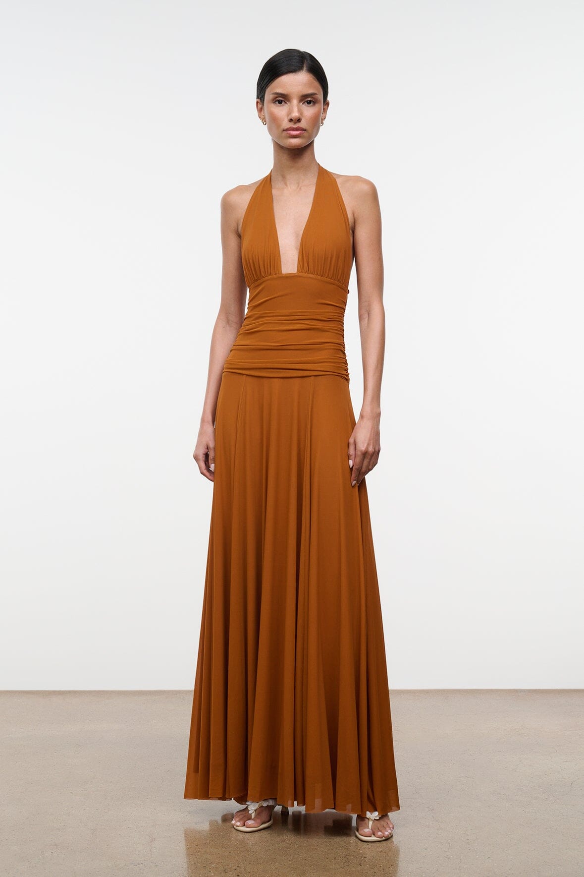 ALESSANDRA halter dress in cocoa-butter brown with ruched bodice and pleated maxi skirt