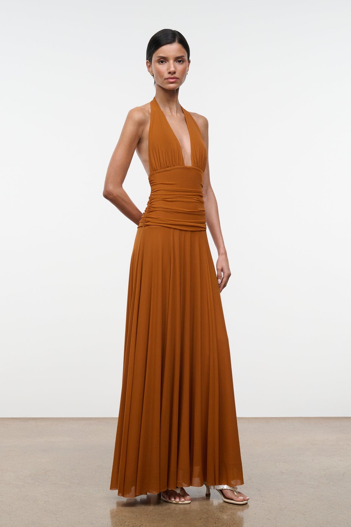 ALESSANDRA halter maxi dress in cocoa-butter brown with ruched waist and flowing pleats