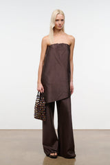 Dark brown strapless top with gathered neckline and side-slit asymmetrical drape