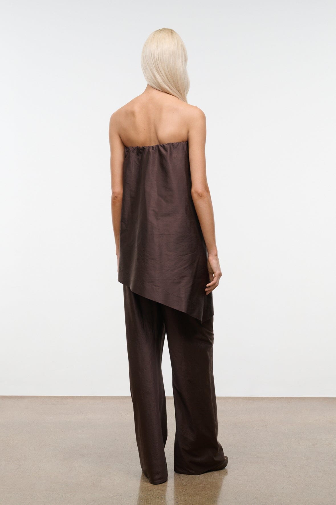 Dark brown strapless convertible top, shown from the back with gathered neckline