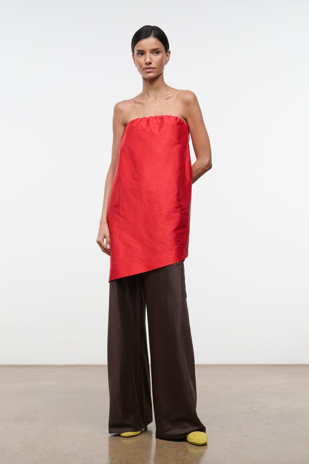Convertible silk dupioni top, strapless red bandeau with asymmetrical hem over wide-leg pants