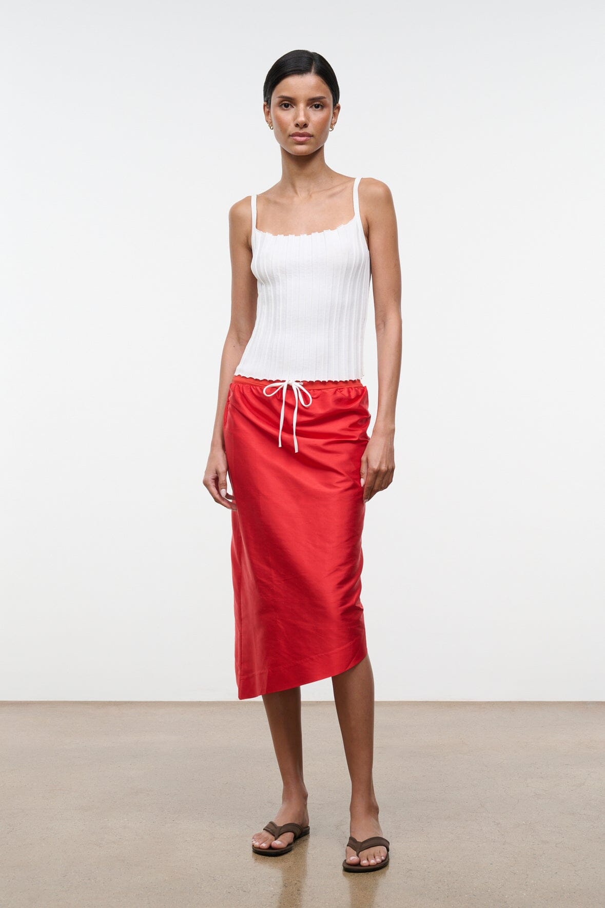 Silk dupioni top in red rose with square neckline, sleeveless; scalloped trim